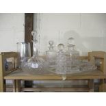 QUANTITY OF CUT GLASS WARES INCLUDING A NUMBER OF DECANTERS, FRUIT BOWL AND VASE