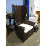 REPRODUCTION DARK STAINED “LAMBING” CHAIR WITH WING BACK, SOLID SEAT AND FRIEZE DRAWER, 76CM WIDE