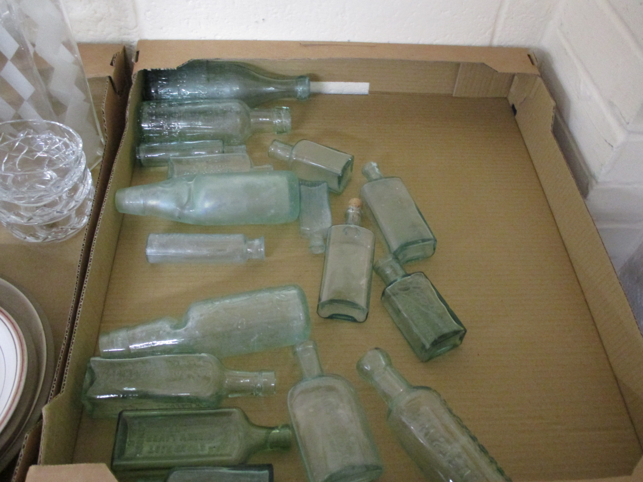 TRAY CONTAINING GREEN GLASS BOTTLES