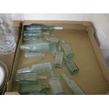 TRAY CONTAINING GREEN GLASS BOTTLES