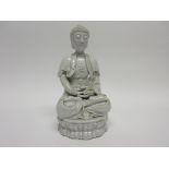 Chinese Ming dynasty style blanc de chine Dehua white glazed figure of Rulai in typical pose, 20cm