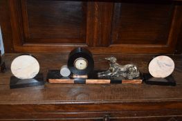 Art Deco period spelter and marble clock garniture, the central clock with metal dog motif, 46cm