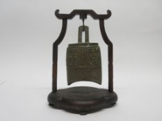 Chinese metal temple jar in wooden frame