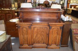 19th century mahogany break front sideboard, scroll moulded pediment over a shelf supported by