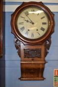 American walnut wall clock, the circular dial with Roman numerals, the case inlaid throughout in the