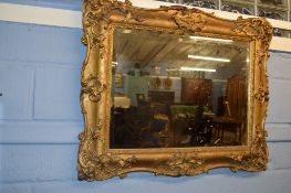 19th century gilt and gesso picture frame (now fitted as a mirror), moulded with C-scrolls and