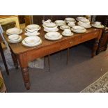 Stained pine kitchen table, of rectangular form with single frieze drawer raised on turned supports,