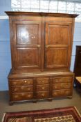 18th century oak housekeeper's cupboard, moulded corners over two double panelled doors and the base