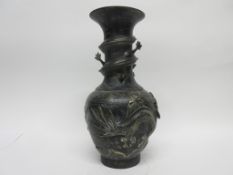 Metal vase, the neck with sinuous dragon and body also modelled in relief with two dragons and the