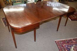 19th century mahogany D-end dining table, the two ends joined by two central leaves with brass clips