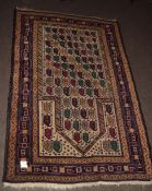 Late 20th century Caucasian rug, triple gull border, central panel of geometric designs, mainly