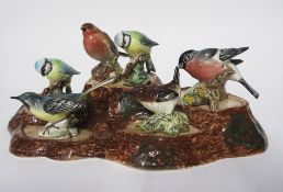 Group of Beswick ware birds mounted on a naturalistic wooden base (6)