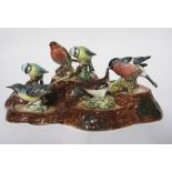 Group of Beswick ware birds mounted on a naturalistic wooden base (6)