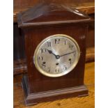 Mahogany cased mantel clock with German movement, circular Arabic chapter ring and bracket feet,