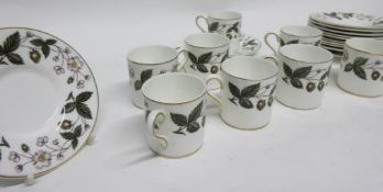 Wedgwood coffee set decorated with the Strawberry Hill pattern comprising 8 coffee cans and saucers,