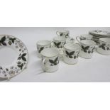 Wedgwood coffee set decorated with the Strawberry Hill pattern comprising 8 coffee cans and saucers,
