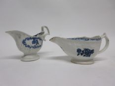 Group of two English porcelain sauce boats, one Lowestoft with floral print and helmet shaped