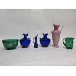 Group of coloured glass vases and jugs, all with painted floral decoration