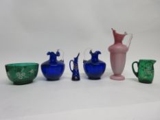 Group of coloured glass vases and jugs, all with painted floral decoration