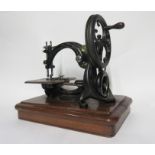 Early Wilcox & Gibbs sewing machine in fitted carrying case, 28cm high