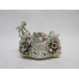Late 19th century Continental porcelain basket with flower encrusted decoration and a cherub to