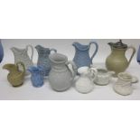 Group of late 19th century relief moulded pottery jugs of various decoration and makers including