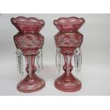 Pair of pink glass table lustres with floral and gilt decoration, 33cm high (2)