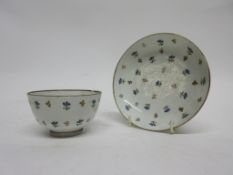 Lowestoft porcelain tea bowl and saucer with a Chantilly sprig type design, the saucer 12cm diam (