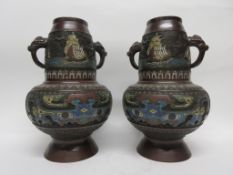 Pair of Oriental vases with cloisonne type decoration with elephant head handles, 33cm high (2)