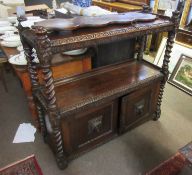 Oak carved buffet, crested at the corners with coronet finials over two open shelves and cupboard