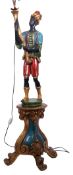 Mid-century painted plaster "blackamoor" standard lamp in the form of a figure standing and