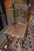 Decorative 19th century bedroom chair with lyre pierced splat and further carved detail and cane