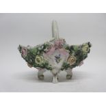 Continental porcelain flower basket on four scroll feet, the sides decorated with flower heads in