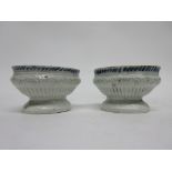 Pair of English porcelain table salts, the ribbed body with blue and white design to interior,