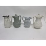 Group of four 19th century relief moulded jugs including one of a drunken Silenius jug and three