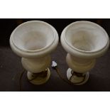 Pair of marble effect.urns of campana form (converted to table lamps), rim chips and one repaired,