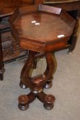 Mahogany samovar stand of octagonal form with single frieze drawer raised on a lyre support