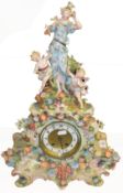 Early 20th century Plaue or Sitzendorf mantel clock, crested with female figure and winged putti,