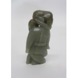 Chinese green jade carving of an Oriental with cat on his shoulder, 8cm high
