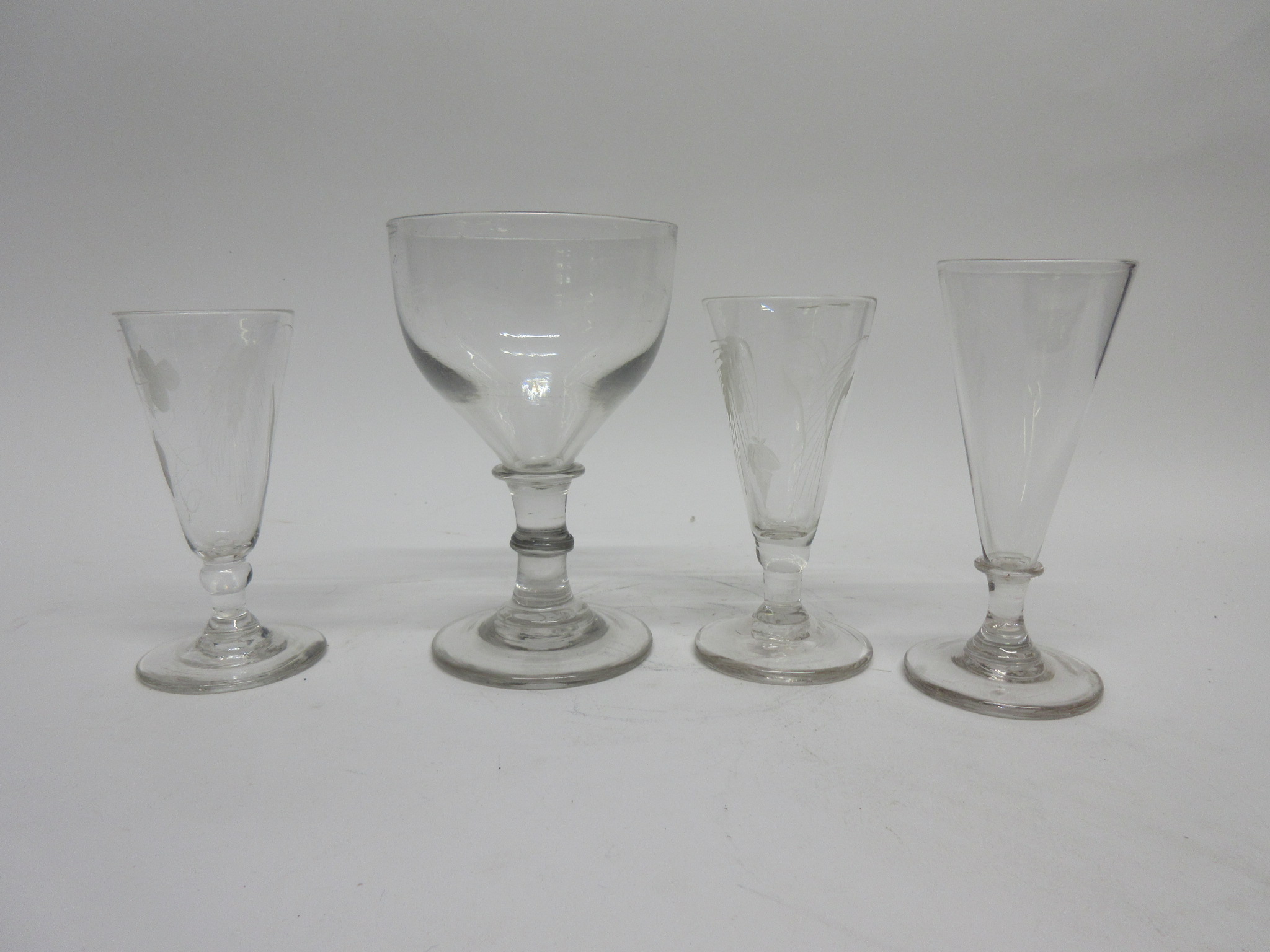 Large 19th century rummer and three further fluted glasses with engraved corn decoration