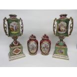 Group of Continental porcelain wares including a pair of vases with covers and decorated with