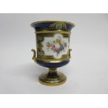 Royal Crown Derby vase with a central spray of flowers on a gilt ground with gilt decoration (