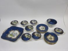 Part Crescent china tea set by George Jones, the mottled blue ground decorated with birds in