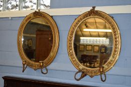 Pair of Victorian oval gilt gesso girandoles, each applied with two sconces (in need of repair),