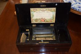 Late 19th century rosewood and ebonised cased music box with cylinder movement (7 teeth missing),