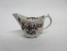 Lowestoft porcelain jug of Chelsea ewer type decorated in Redgrave style with a floral pattern and