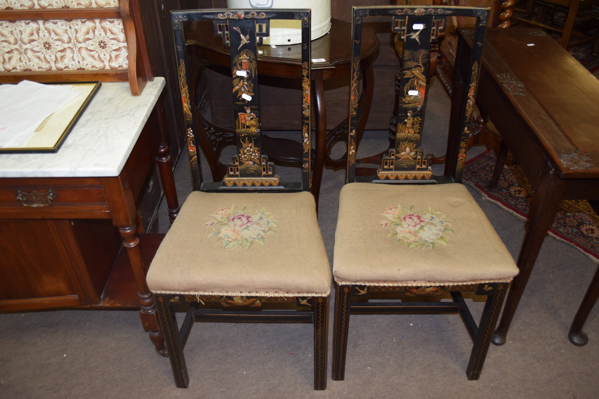 Pair of decorative japanned lacquered bedroom chairs, each with grospoint wool embroidered seats and