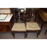 Pair of decorative japanned lacquered bedroom chairs, each with grospoint wool embroidered seats and