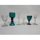 Two 18th century air-twist wine glasses together with two further green coloured wine glasses plus