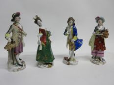 Group of four Continental porcelain figures of ladies and gentlemen, (4)